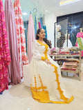 HABESHA KEMIS – YELLOW ETHIOPIAN TRADITIONAL DRESS WITH GOLDEN EMBROIDERY | HABESHA DRESS