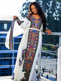 HABESHA DRESS WITH COLORFUL WOVEN PANELS REPRESENTING ETHIOPIAN CLOTHING TRADITION