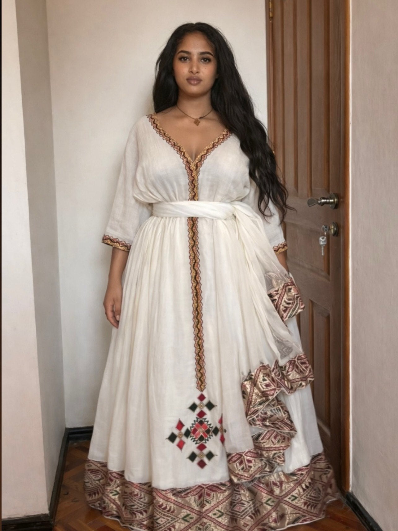  TRADITIONAL ATTIRE WITH V-NECK SILHOUETTE AND HERITAGE INFLUENCE