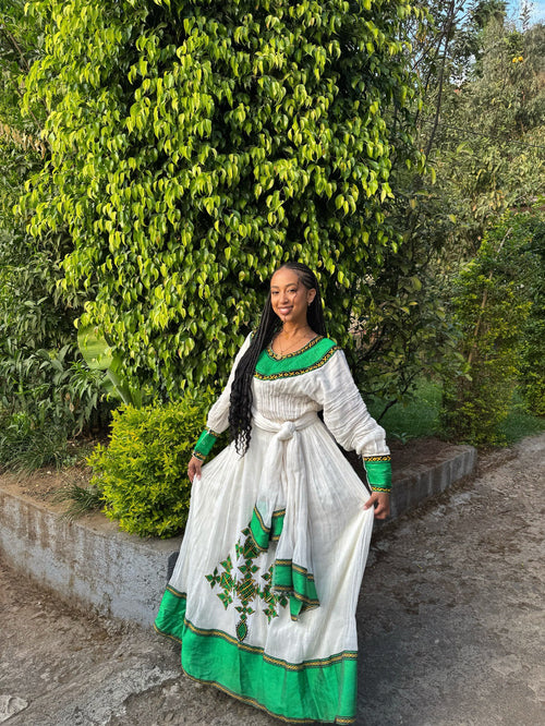 GREEN WOVEN HABESHA KEMIS INSPIRED BY TRADITIONAL ETHIOPIAN DRESS AND HERITAGE