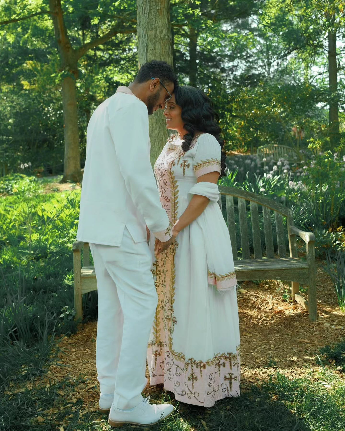 VERONICA ETHIOPIAN WEDDING COUPLE'S OUTFIT | WHITE HABESHA DRESS AND MEN’S SUIT | GOLD AND PINK EMBROIDERY HABESHA COUPLE'S OUTFIT