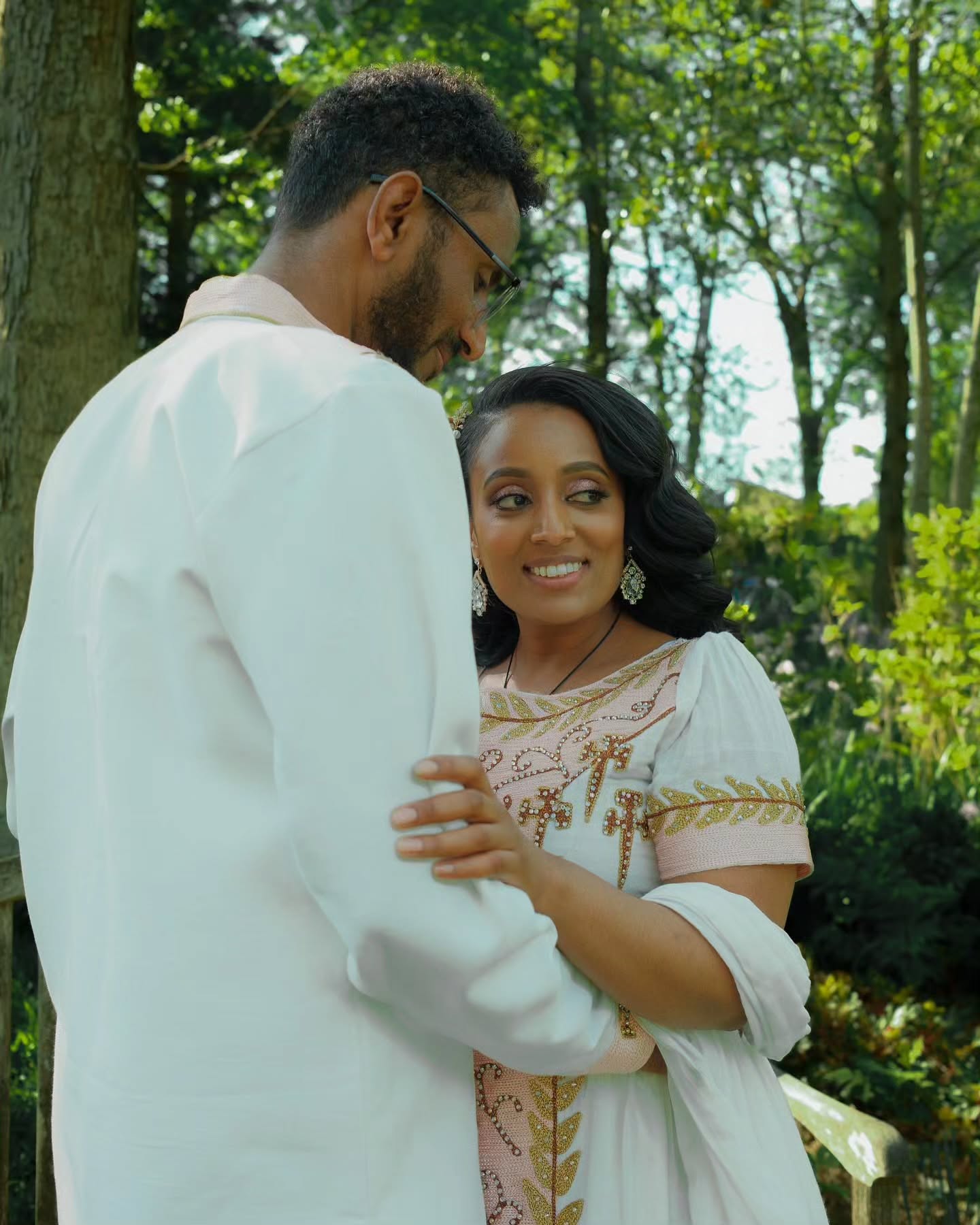 VERONICA ETHIOPIAN WEDDING COUPLE'S OUTFIT | WHITE HABESHA DRESS AND MEN’S SUIT | GOLD AND PINK EMBROIDERY HABESHA COUPLE'S OUTFIT