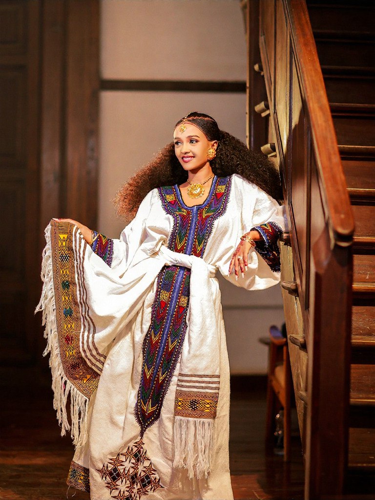 TRADITIONAL ETHIOPIAN DRESS – WHITE HABESHA KEMIS WITH GOLD & PURPLE EMBROIDERY