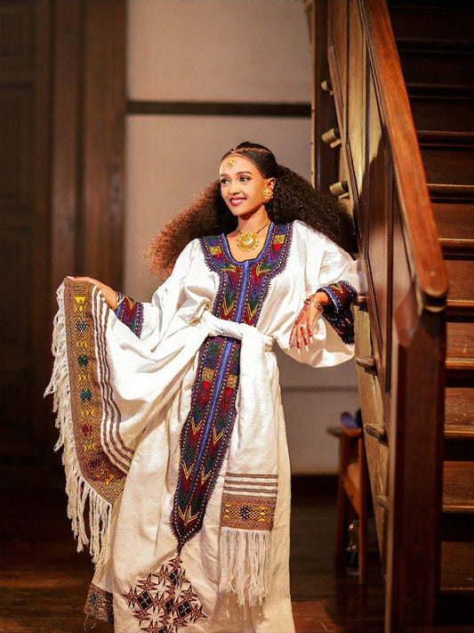TRADITIONAL ETHIOPIAN DRESS – WHITE HABESHA KEMIS WITH GOLD & PURPLE EMBROIDERY