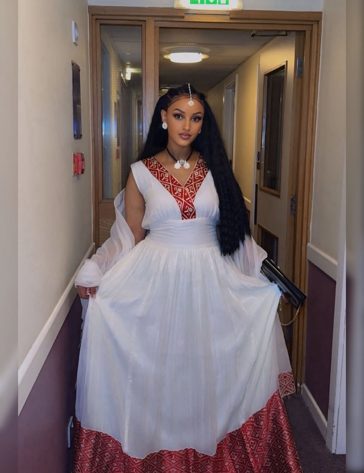 SLEEVELESS HABESHA KEMIS WITH RED WOVEN ROOTED IN TRADITIONAL ETHIOPIAN CLOTHING