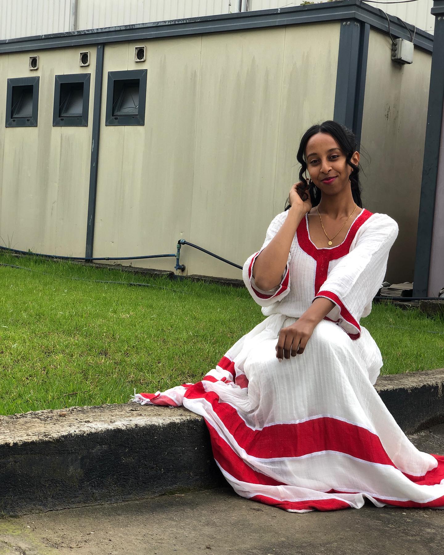 RED WOVEN HABESHA DRESS ELEGANTLY REIMAGINED AS A CLASSIC HABESHA KEMIS INSPIRED BY ETHIOPIAN CLOTHING HERITAGE