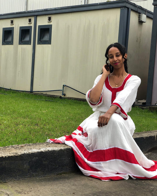 RED WOVEN HABESHA DRESS ELEGANTLY REIMAGINED AS A CLASSIC HABESHA KEMIS INSPIRED BY ETHIOPIAN CLOTHING HERITAGE